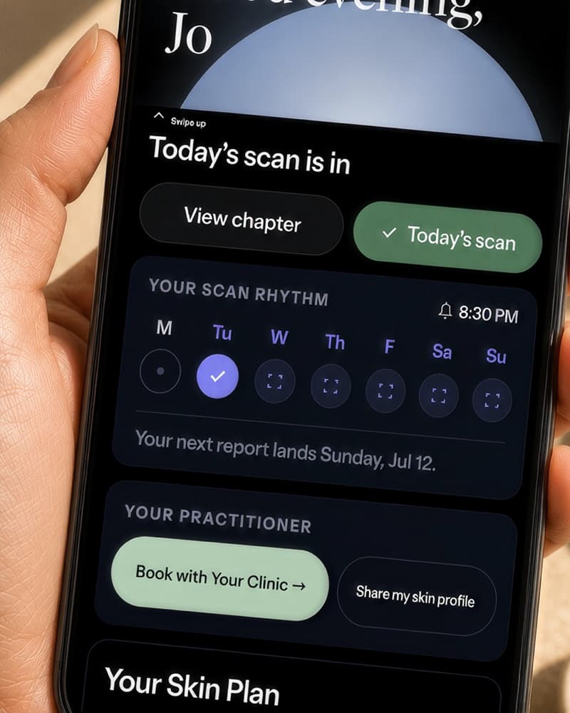 A close-up of the Stella app in a client's hand — their scan rhythm and practitioner card, with booking and profile sharing