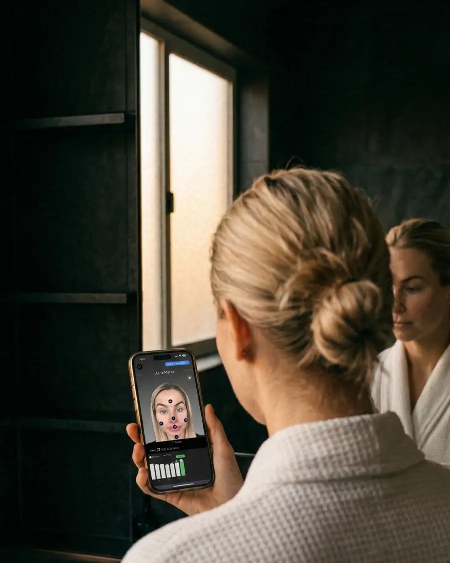 Woman viewing her Stella skin analysis results on her phone