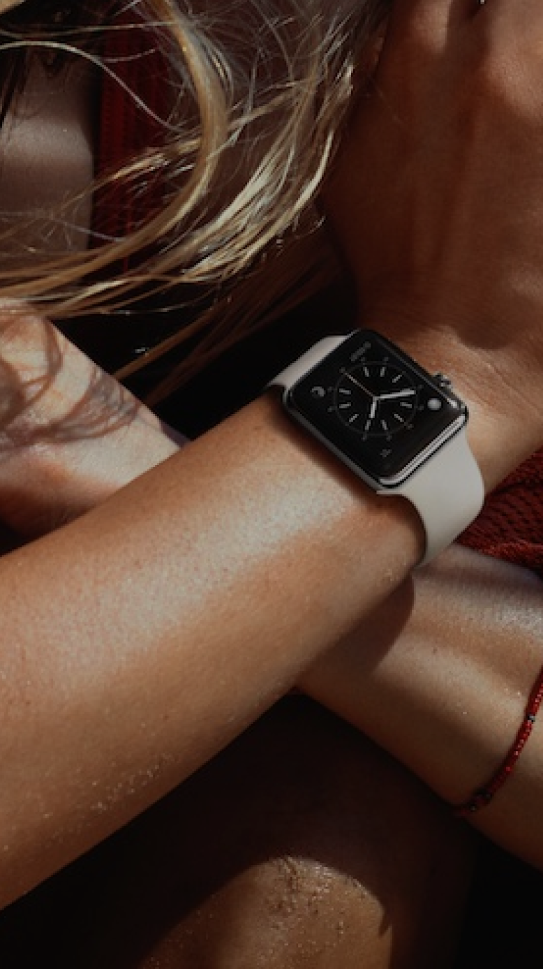 Woman with Apple Watch in natural light.